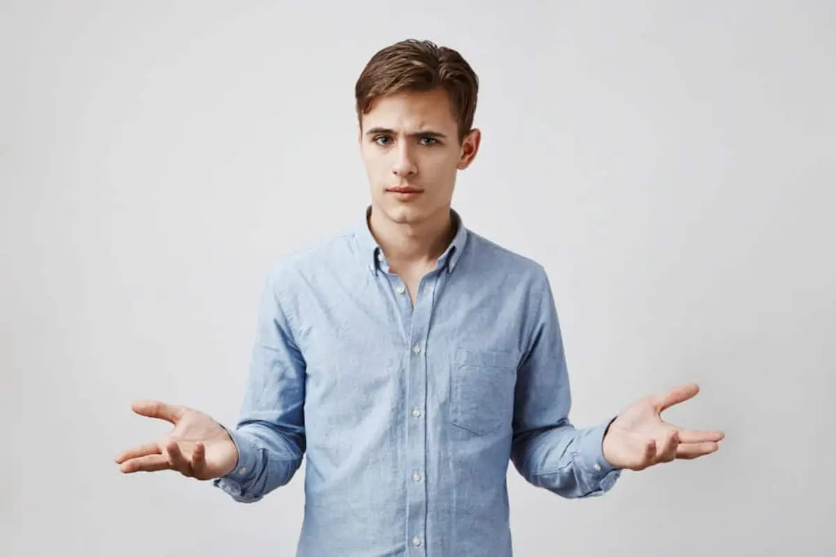 Confused man shrugging