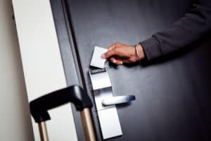 shutterstock 565385338 Young,Indian,Man,Unlocking,His,Hotel,Room
