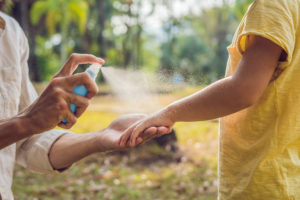 shutterstock 1081091330 Dad,And,Son,Use,Mosquito,Spray.spraying,Insect,Repellent,On,Skin