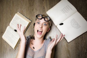 shutterstock 90402586 Portrait,Of,Crazy,Student,In,Glasses,With,Books,And,Cockroaches