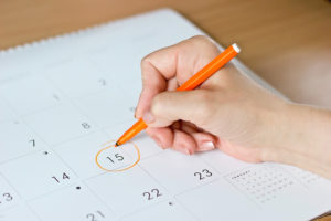 shutterstock 409991398 A,Female,Hand,Circling,The,Date,Of,The,15th,Day