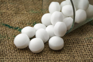shutterstock 639441706 Moth,Balls,In,The,Glass,Over,The,Sackcloth.
