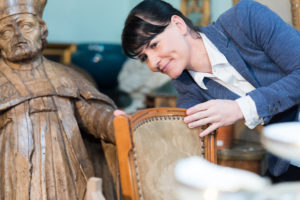 shutterstock 1999631840 Portrait,Of,A,Lady,Inspecting,Antique,Chair