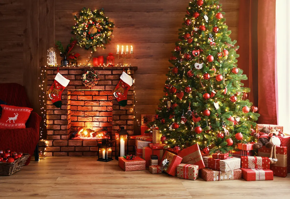 Cozy Christmas living room with decorated tree and fireplace