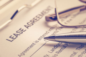 shutterstock 1072039904 Business,Legal,Document,Concept,:,Pen,And,Glasses,On,A