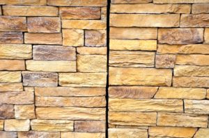 shutterstock 2069865569 Stone,Wall,Made,Of,Regular,Sandstone,Cladding.,Roughly,Hewn,Boards