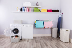 laundry room Basket,Full,Of,Dirty,Clothes,In,Front,Of,Washing,Machine