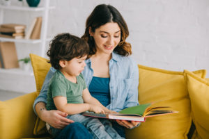 childrens cover Mom,And,Son,Sitting,On,Yellow,Sofa,And,Reading,Book
