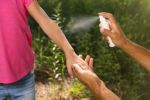 picnic pest control Father,Spraying,Tick,Repellent,On,His,Little,Daughter's,Arm,During