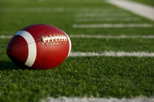 football 2 cover American,Football,On,The,Field,Near,The,Hashmarks,Or,Yard