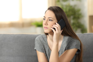 things to remember when to call Serious,Woman,Attending,A,Phone,Call,Sitting,On,A,Sofa