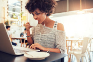 what if day off fleas Portrait,Of,Young,African,Woman,Drinking,Coffee,And,Using,Laptop