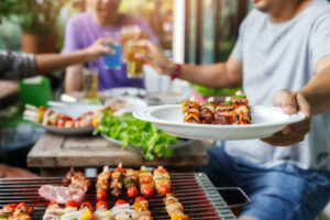 bbq pests prevent A,Man,With,A,Barbecue,Plate,At,A,Party,Between