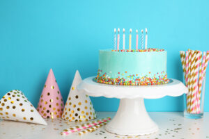 birthday cover Fresh,Delicious,Cake,And,Birthday,Caps,On,Table,Against,Color
