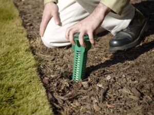 Man installing Sentricon Termite System