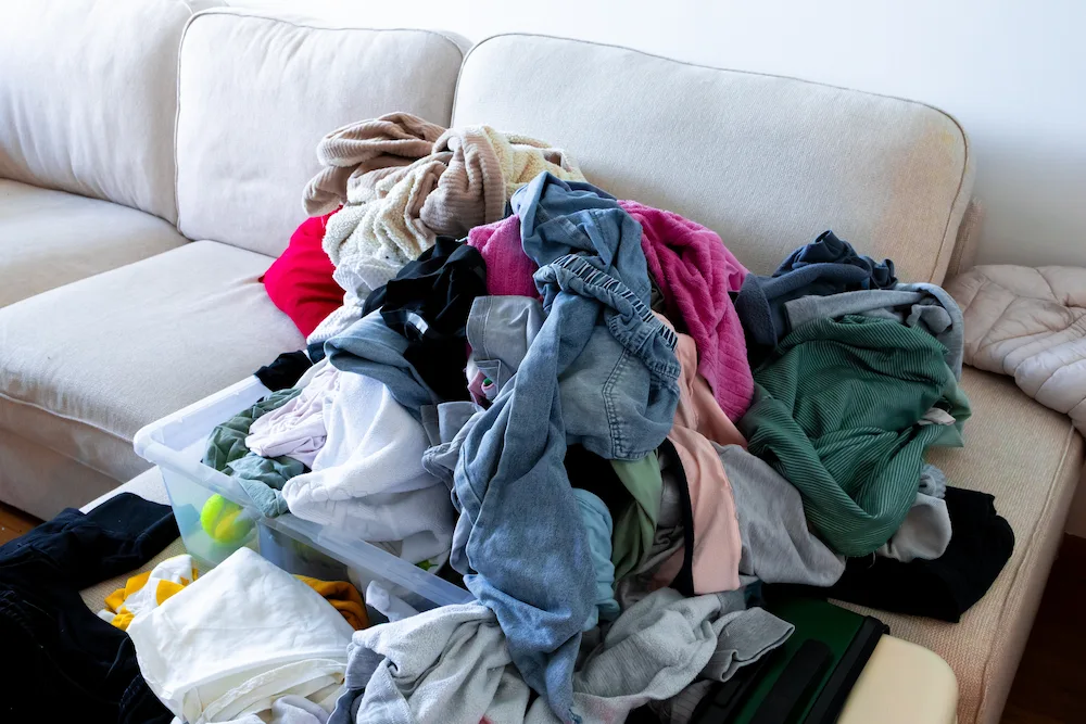 laundry pile on couch